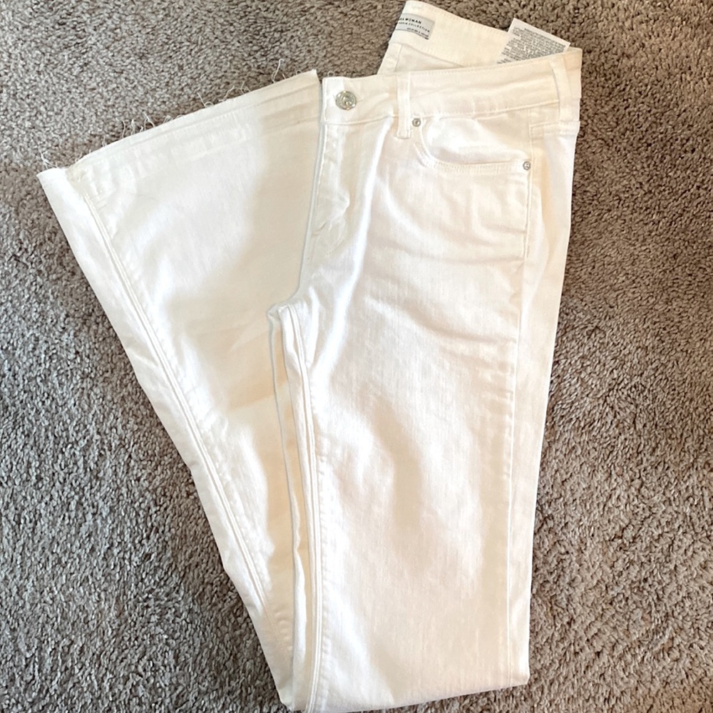 Zara White Flare jeans with raw hem.